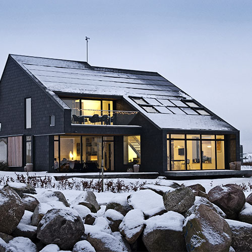 Outside view of Home for Life house covered in snow